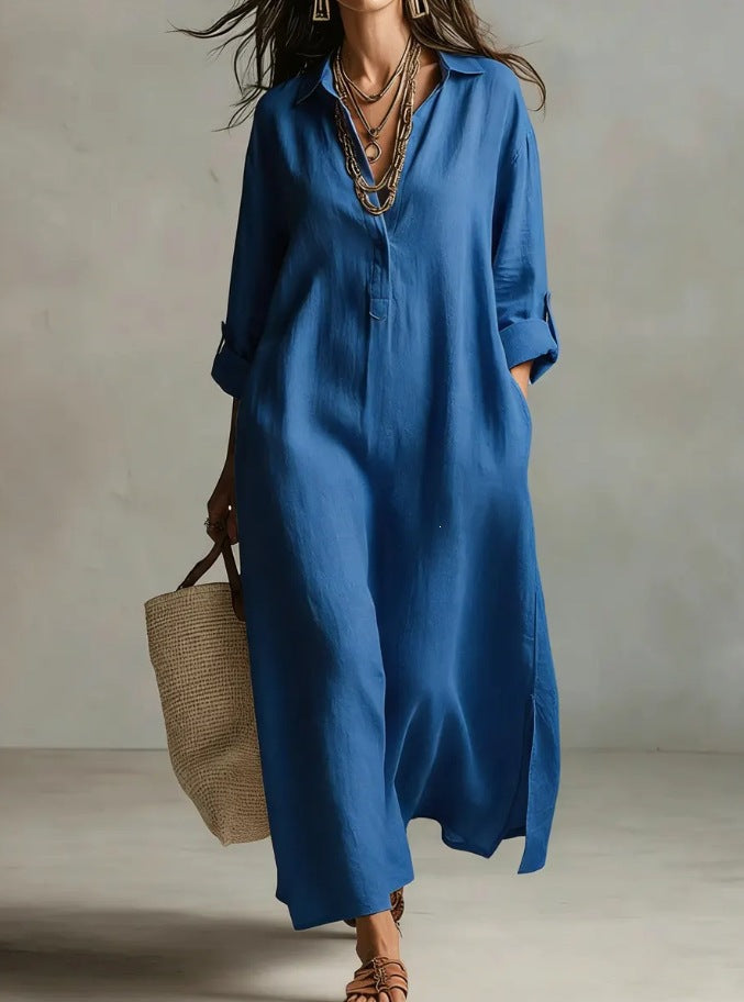 A Beige Linen Shirt Dress With A Relaxed French Vacation Vibe, Featuring A Turned-down Collar With A Half-placket, Rolled-up Sleeves, Side-slit Pockets, And A Long Shirt Dress Designperfect For Trave