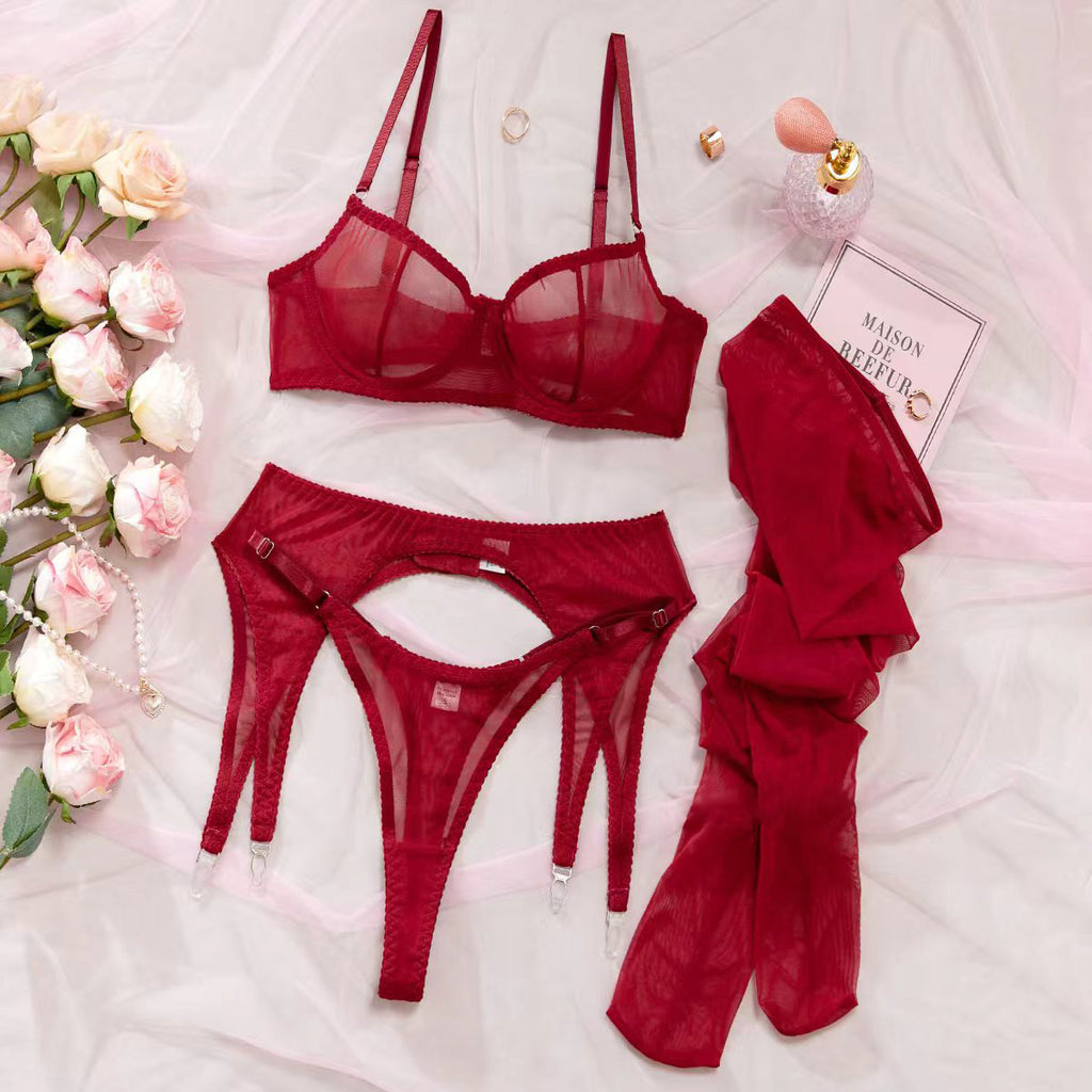 A Four-piece Lingerie Set With Silk Stockings