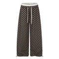 Ruffle-trimmed Printed Straight-leg Pants In Solid Color