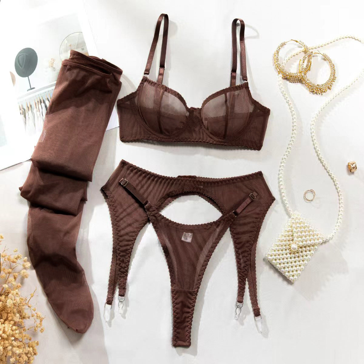 A Four-piece Lingerie Set With Silk Stockings