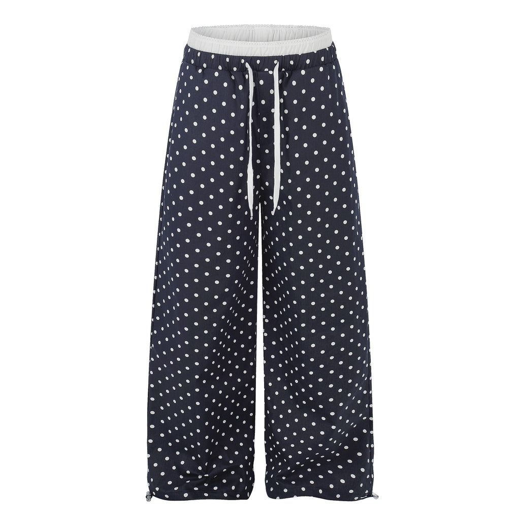 Ruffle-trimmed Printed Straight-leg Pants In Solid Color